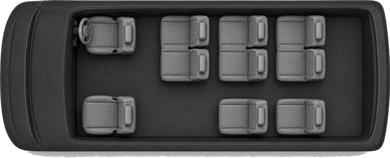 Toyota HiAce Grand Cabin seen from above — driver seat plus nine passenger seats and the luggage bay. The factory van seats 14; RydAgent's is converted to 10 seats so nine 28-inch suitcases ride inside the van.