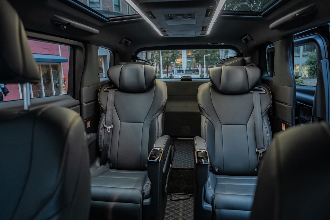 Luxury black leather interior of a Toyota Alphard with captain seats